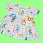 Alphabet Puppet Babydoll Dress (3X)